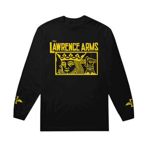 Image of a black longsleeve against a white background. Across the chest in yellow text reads "the lawrence arms". Below that inside of a yellow outlined rectangle is a graphic of a king holding a sword behind his head. The cuffs of the sleeves feature the lawrence arms logo in yellow- an hourglass with wings.