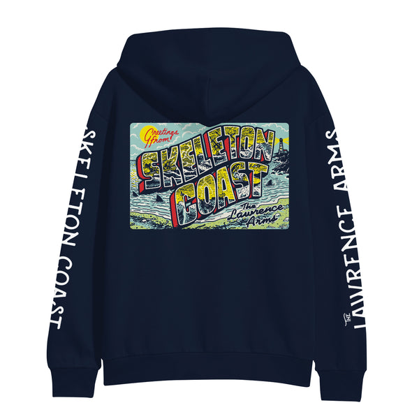 Image of the back of a navy hoodie against a white background. The left sleeve says "skeleton coast" and the right says "the lawrence arms". The back has a graphic of a post card- it is colorful and says greetings from skeleton coast. the lawrence arms. there is a sun, some clouds, the oceans, and fins from sharks sticking out of the water.  The words Skeleton coast are in large colorful bubble letters.