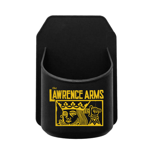 image of a black. plastic shower beer holder on a white background. the back is flat and has adhesive that will stick on a shower wall. the front has a round spot for a beverage can. on the front is a small print in yellow of the suicide king with a sword through his head and the words the lawrence arms at the top