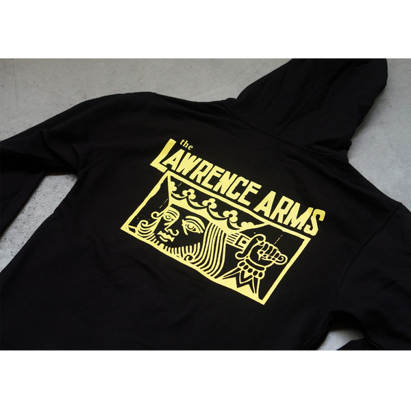 Close up image of the back of a black zip up hoodie against a gray background. Across the back in yellow text reads "the lawrence arms". Below that inside of a yellow outlined rectangle is a graphic of a king holding a sword behind his head. The cuffs of the sleeves feature the lawrence arms logo in yellow.
